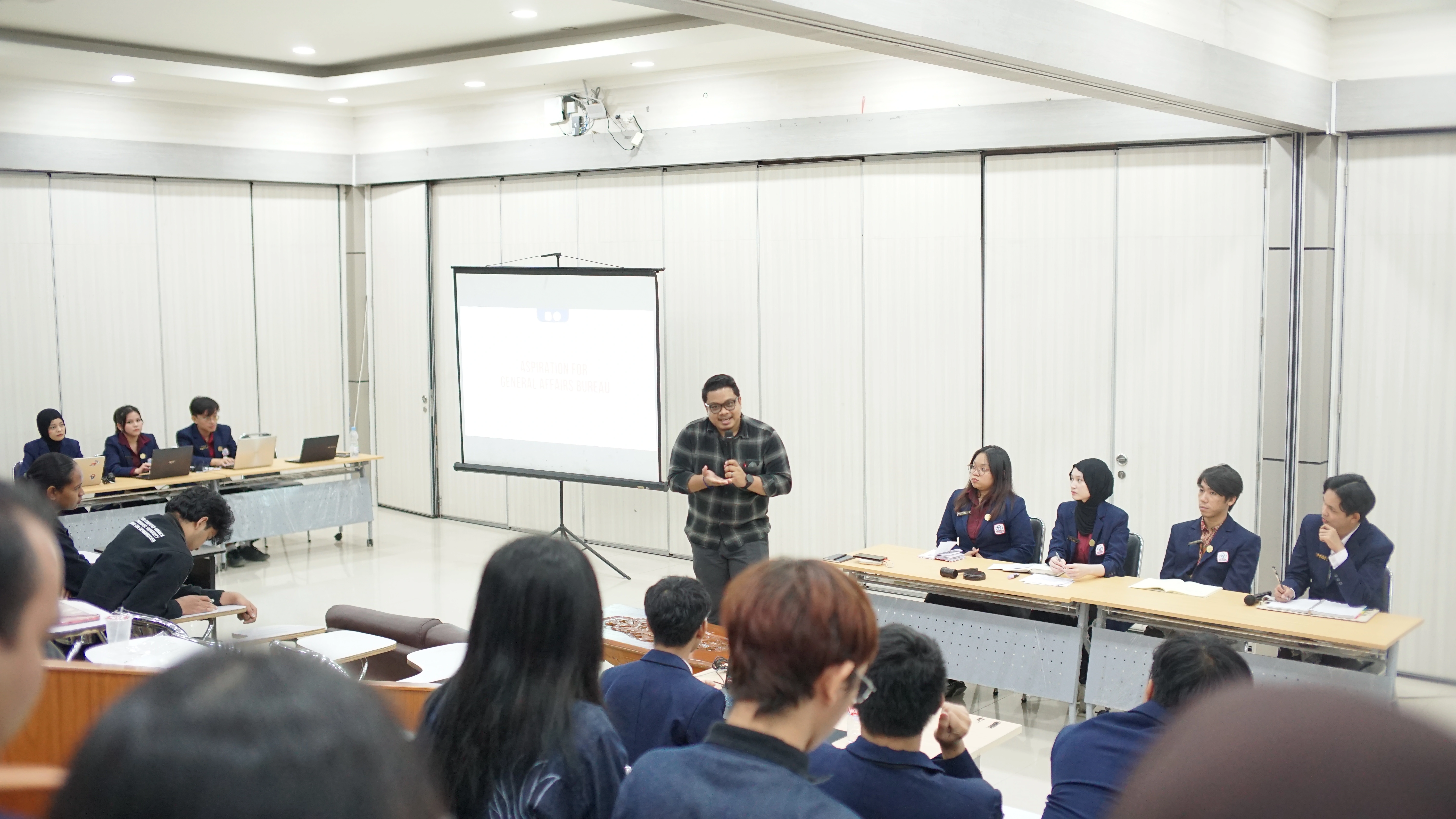 Dr. Iman Permana receiving token of appreciation